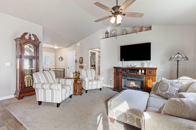 carpeted living room with lofted ceiling and ceiling fan