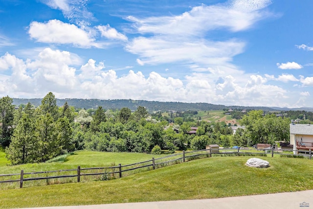 mountain view featuring a rural view