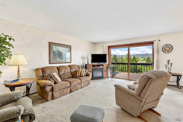 living room with light colored carpet and a textured ceiling