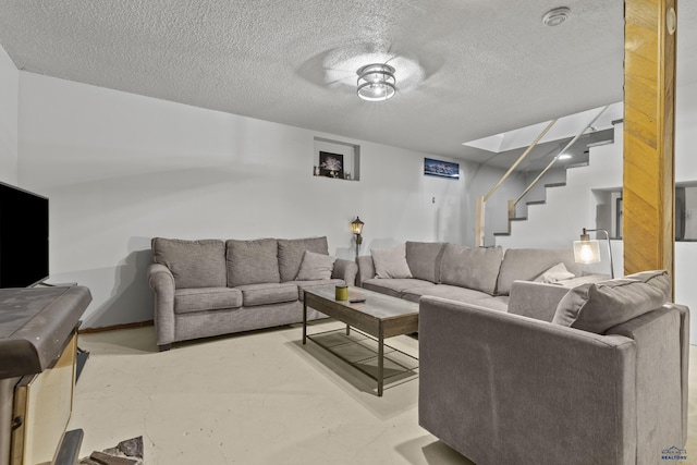 living room featuring a textured ceiling