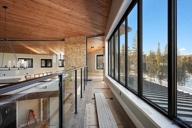 interior space featuring lofted ceiling, wood ceiling, and light hardwood / wood-style floors