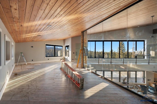 interior space with wood-type flooring, wooden ceiling, and vaulted ceiling