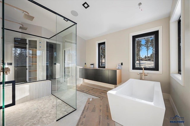 bathroom featuring separate shower and tub