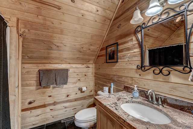 bathroom with walk in shower, lofted ceiling, toilet, wood walls, and vanity