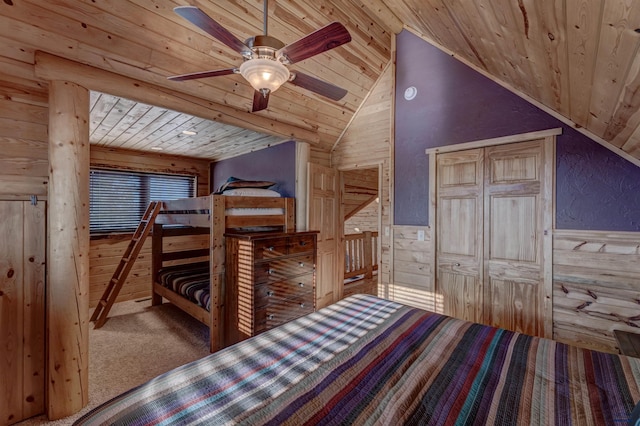 carpeted bedroom with wood walls, lofted ceiling, and wooden ceiling
