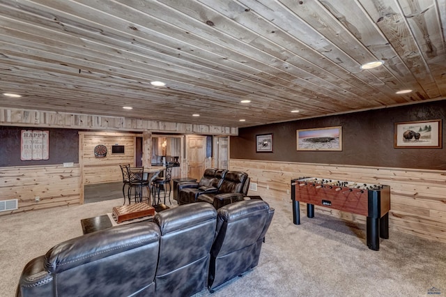 interior space featuring carpet floors, wood ceiling, and wooden walls