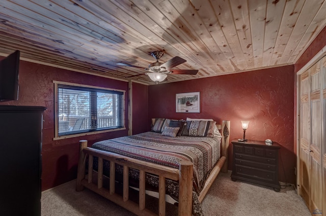 bedroom with ceiling fan, light colored carpet, and wood ceiling