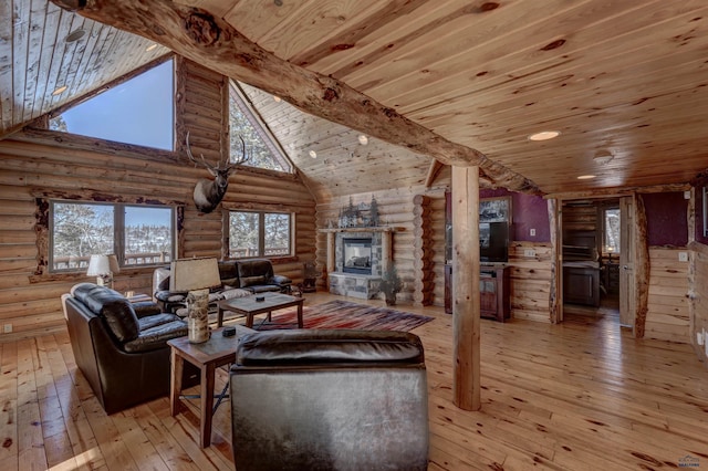 living room featuring a stone fireplace, high vaulted ceiling, light hardwood / wood-style flooring, wooden ceiling, and beam ceiling