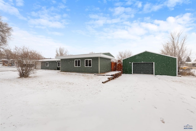 view of front of house with an outbuilding and a garage