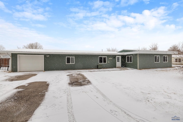 ranch-style house featuring a garage