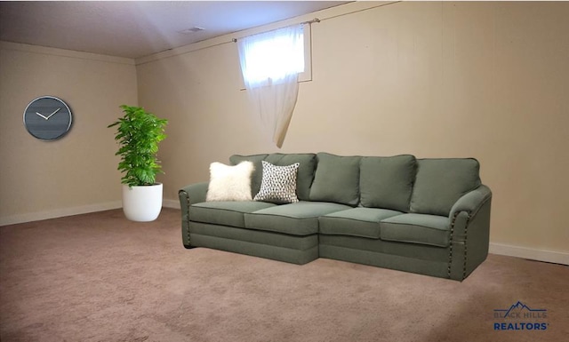 living room featuring ornamental molding and light carpet