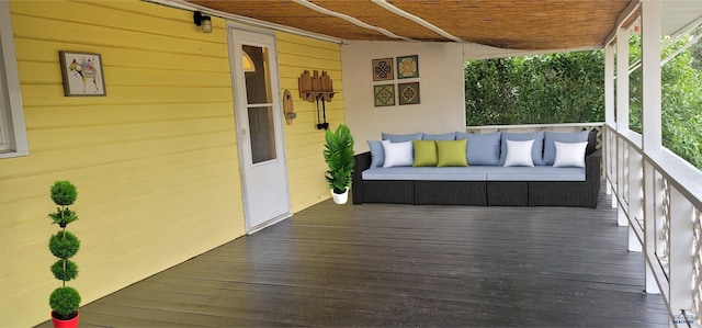 wooden terrace featuring outdoor lounge area