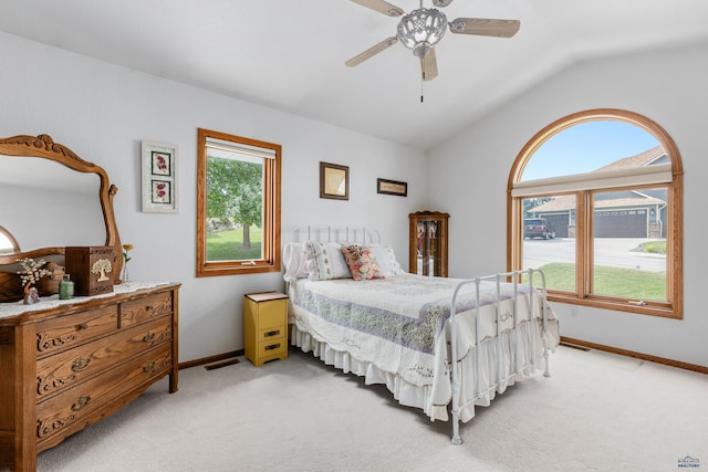 1021 Alta Vista Dr, Rapid City, SD 57701 - bedroom featuring vaulted ceiling, light colored carpet, baseboards, and a ceiling fan