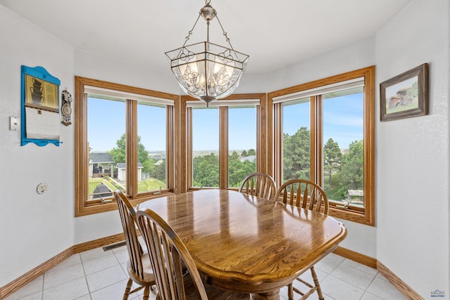 1021 Alta Vista Dr, Rapid City, SD 57701 - dining room featuring a chandelier, baseboards, and light tile patterned floors