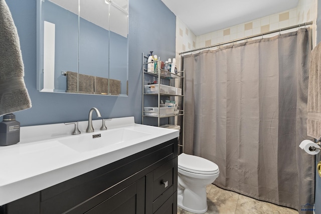 bathroom with vanity, toilet, and a shower with shower curtain