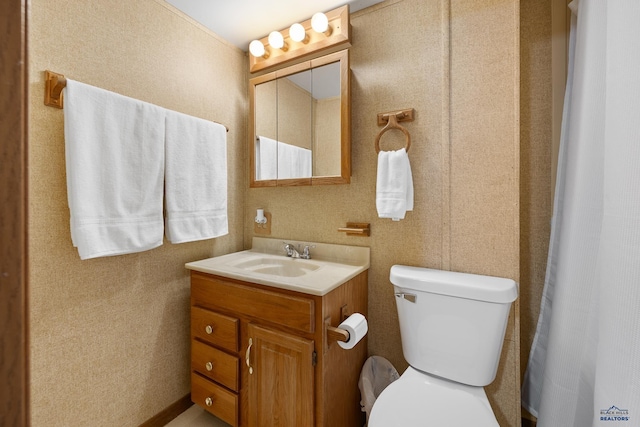 bathroom with vanity and toilet