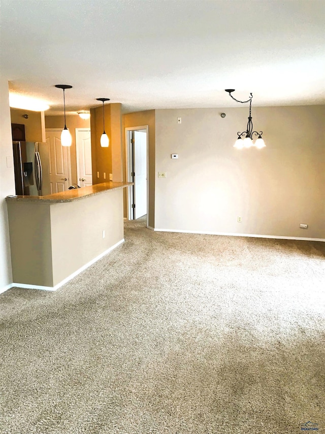 unfurnished living room featuring carpet floors