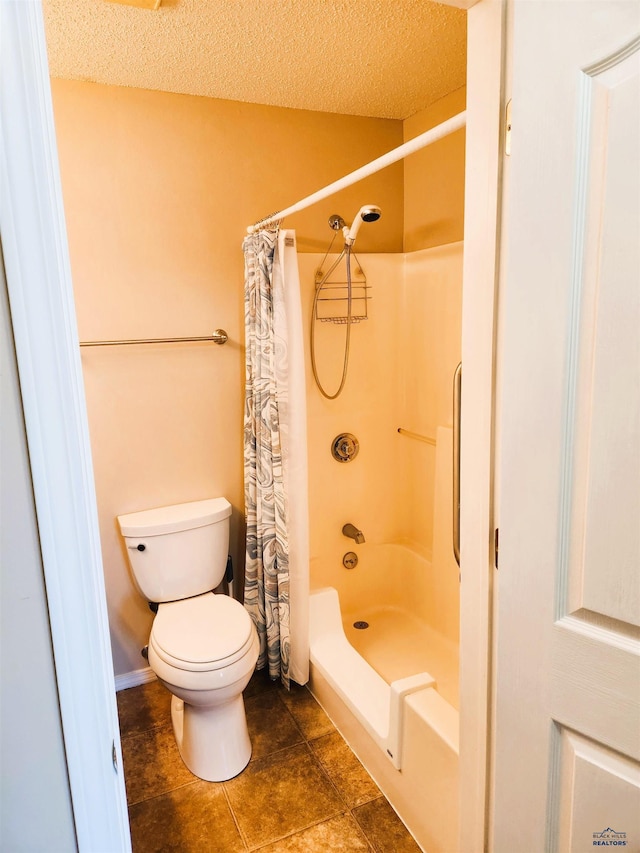 bathroom featuring walk in shower, toilet, and a textured ceiling