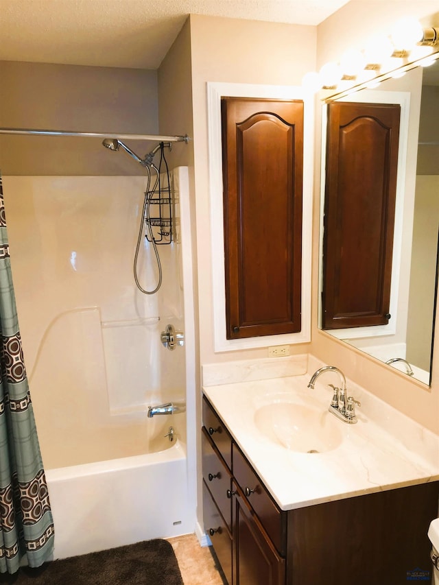 bathroom featuring tile patterned flooring, vanity, and shower / tub combo with curtain