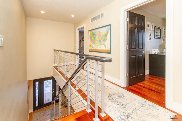 corridor featuring hardwood / wood-style flooring