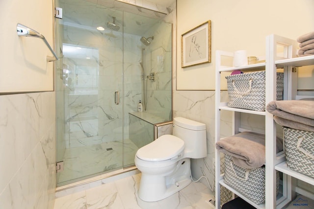 bathroom with toilet, a shower with shower door, and tile walls