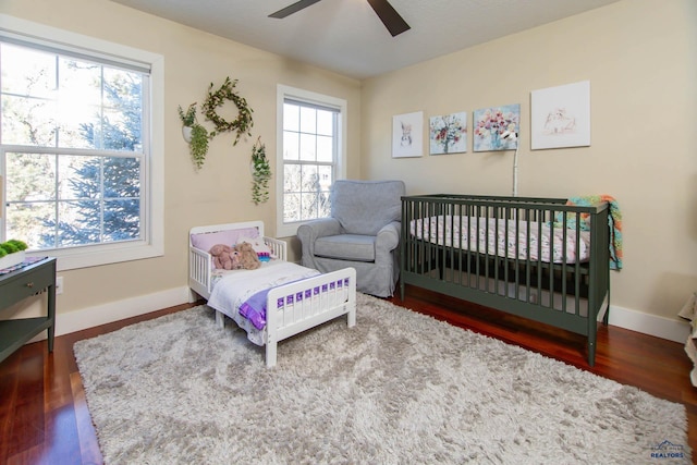 bedroom with hardwood / wood-style flooring and ceiling fan