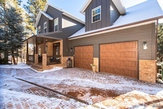 view of front of home with a garage and a porch