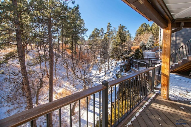 view of snow covered deck