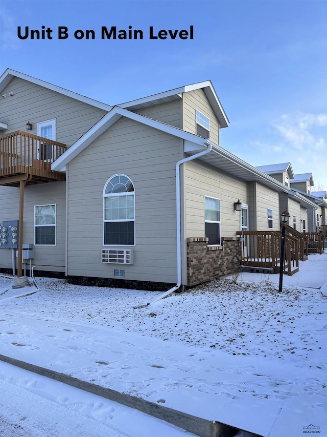 view of snow covered house