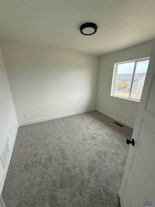 648 Valor Ct, Box Elder, SD 57719 - carpeted spare room with baseboards