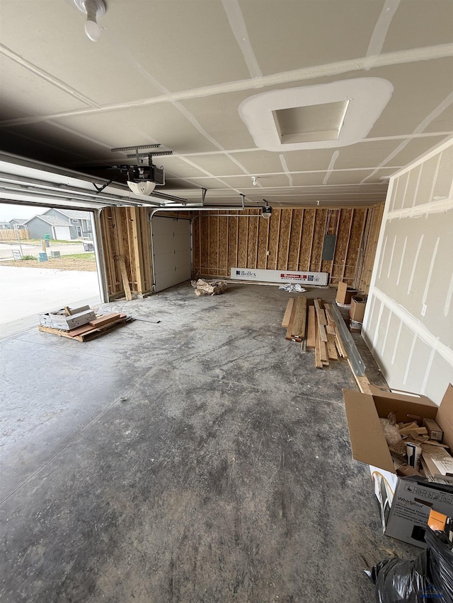 648 Valor Ct, Box Elder, SD 57719 - garage featuring a garage door opener and electric panel