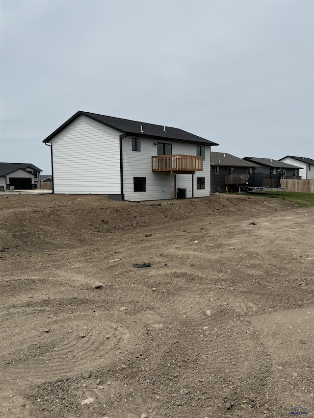 648 Valor Ct, Box Elder, SD 57719 - back of property featuring a trampoline