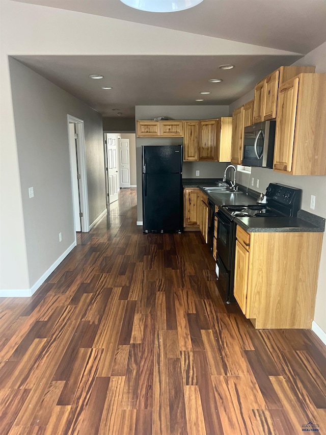 kitchen with dark wood-type flooring, sink, light brown cabinets, and black appliances