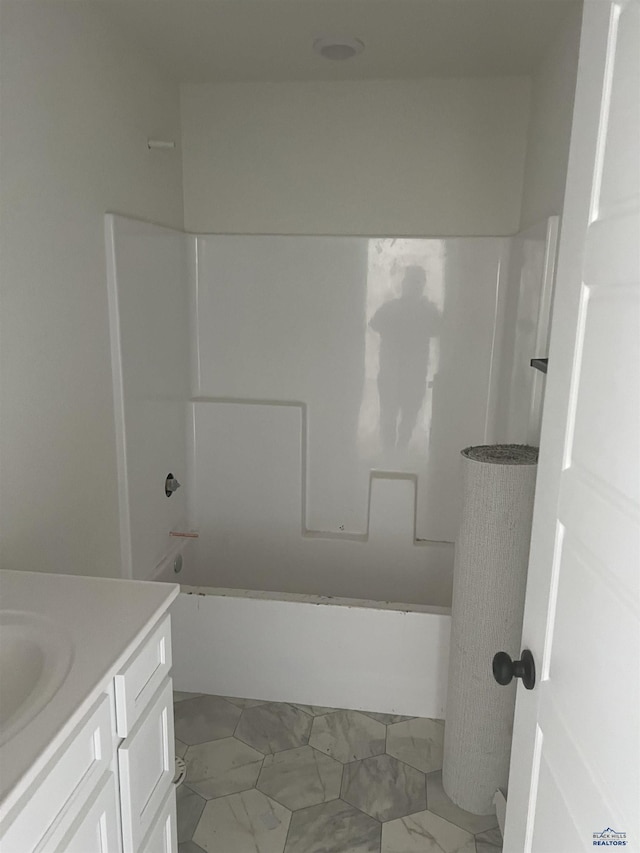 bathroom with shower / washtub combination and vanity