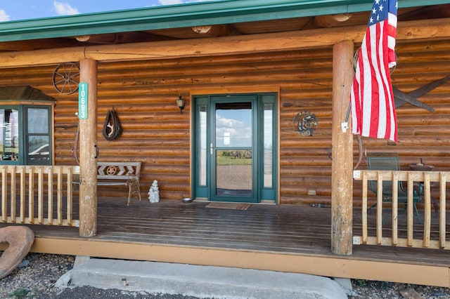 doorway to property with covered porch