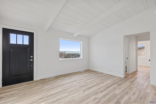 entrance foyer featuring light hardwood / wood-style flooring, lofted ceiling with beams, and wooden ceiling