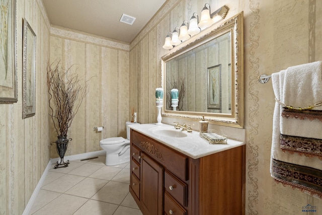 bathroom with vanity, tile patterned floors, and toilet