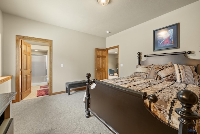 carpeted bedroom with connected bathroom