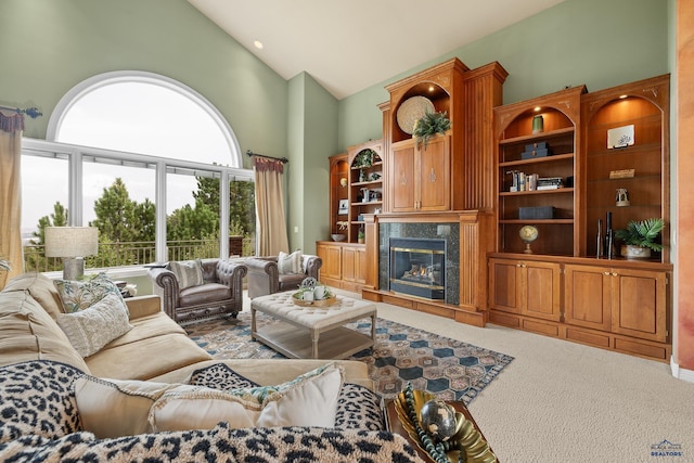 living room with a premium fireplace, carpet flooring, and high vaulted ceiling