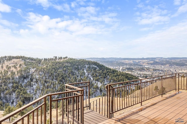 wooden deck with a mountain view