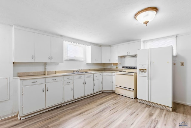 kitchen with white appliances, light wood-type flooring, white cabinetry, and sink