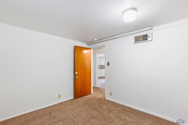 spare room featuring carpet flooring