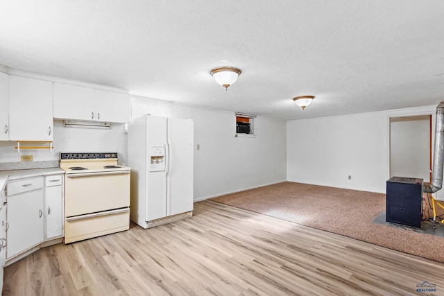 kitchen with white appliances, light wood-type flooring, white cabinetry, and a textured ceiling