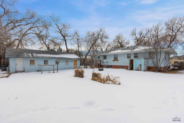 view of snow covered property