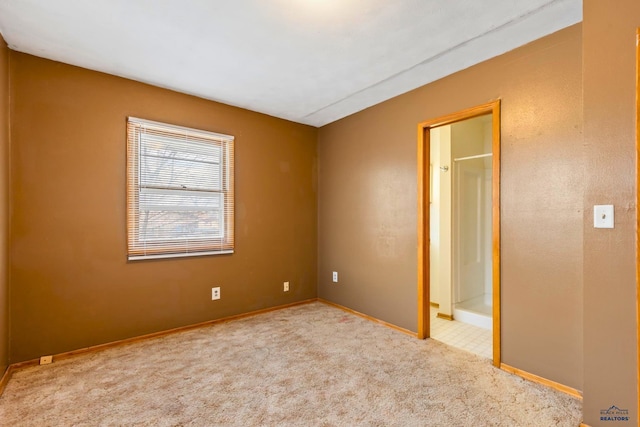 unfurnished bedroom featuring light colored carpet