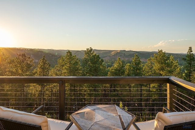 view of balcony at dusk