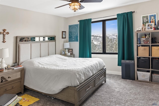 bedroom featuring a mountain view, carpet flooring, and ceiling fan