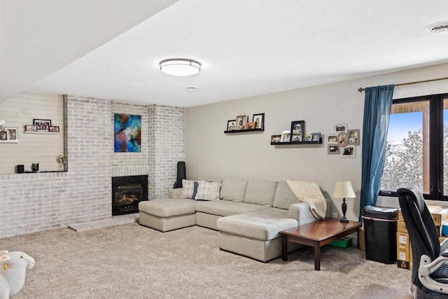 living room with carpet floors and a brick fireplace