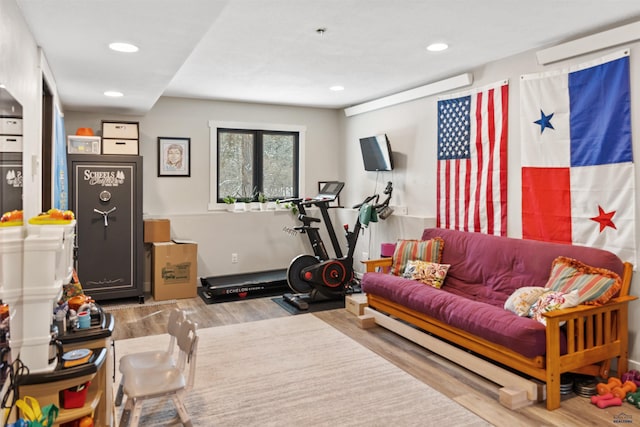 workout room with hardwood / wood-style floors