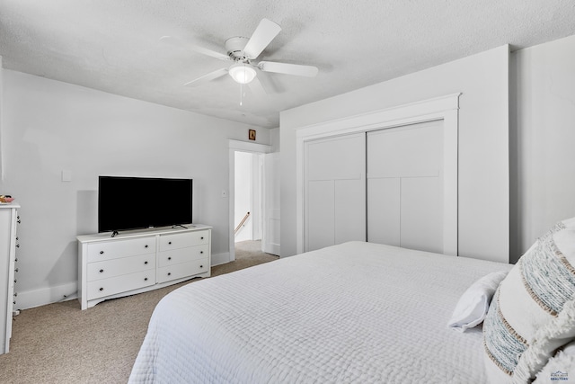 1016 W Blvd, Rapid City, SD 57701 - carpeted bedroom featuring a textured ceiling, ceiling fan, a closet, and baseboards